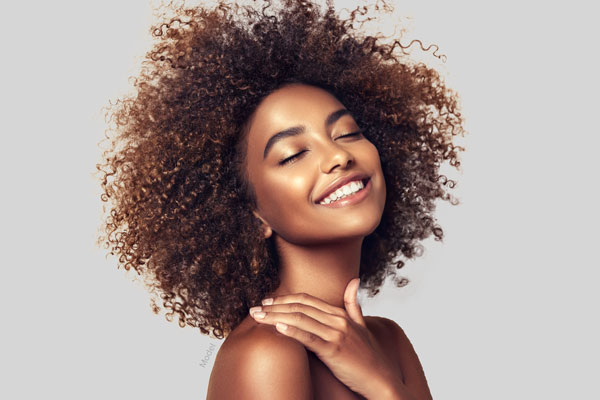 Young woman with wild curly hair