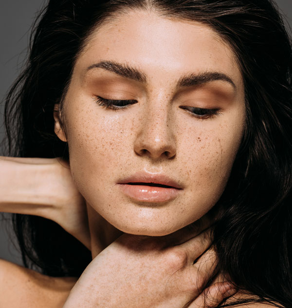 Beautiful woman with freckles on her face