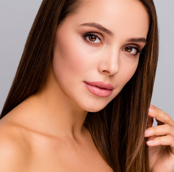 Young woman with brown eyes and straight brown hair